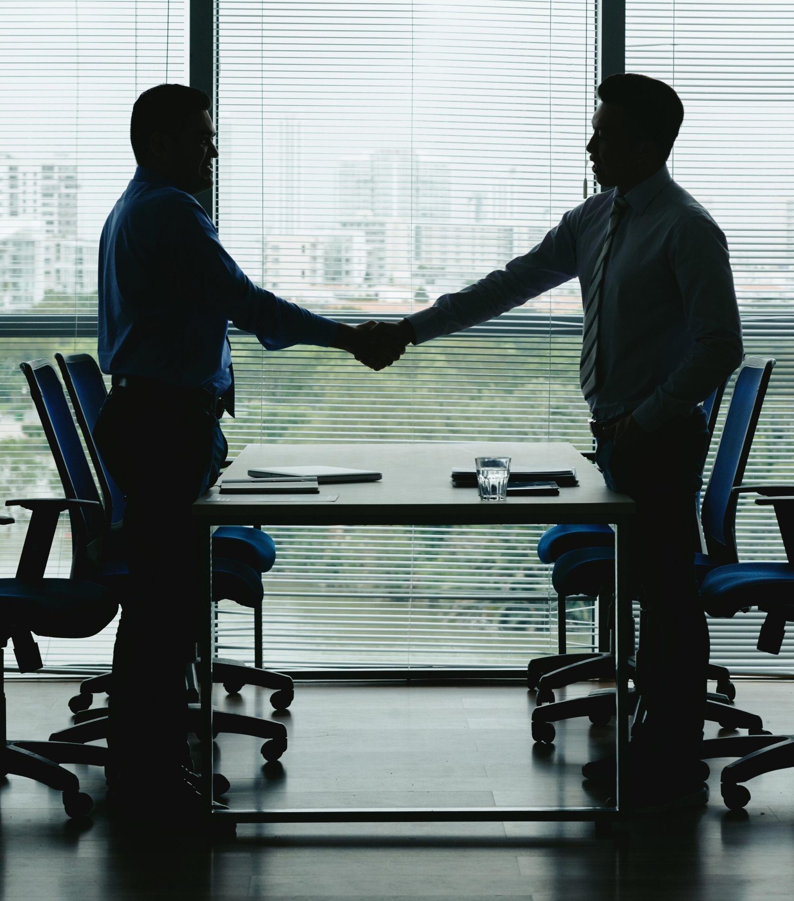 outlines two business people shaking hands celebrate win win deal